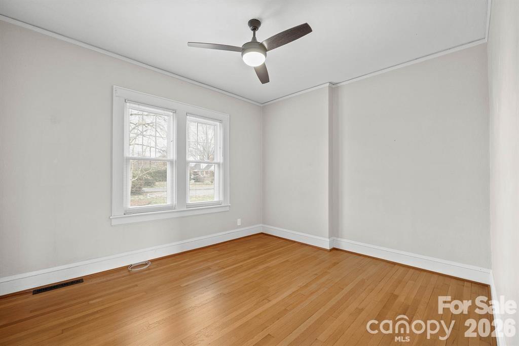 333 7th Street Northwest Hickory, NC 28601 - Photo 13 of 23 a view of empty room with wooden floor and fan