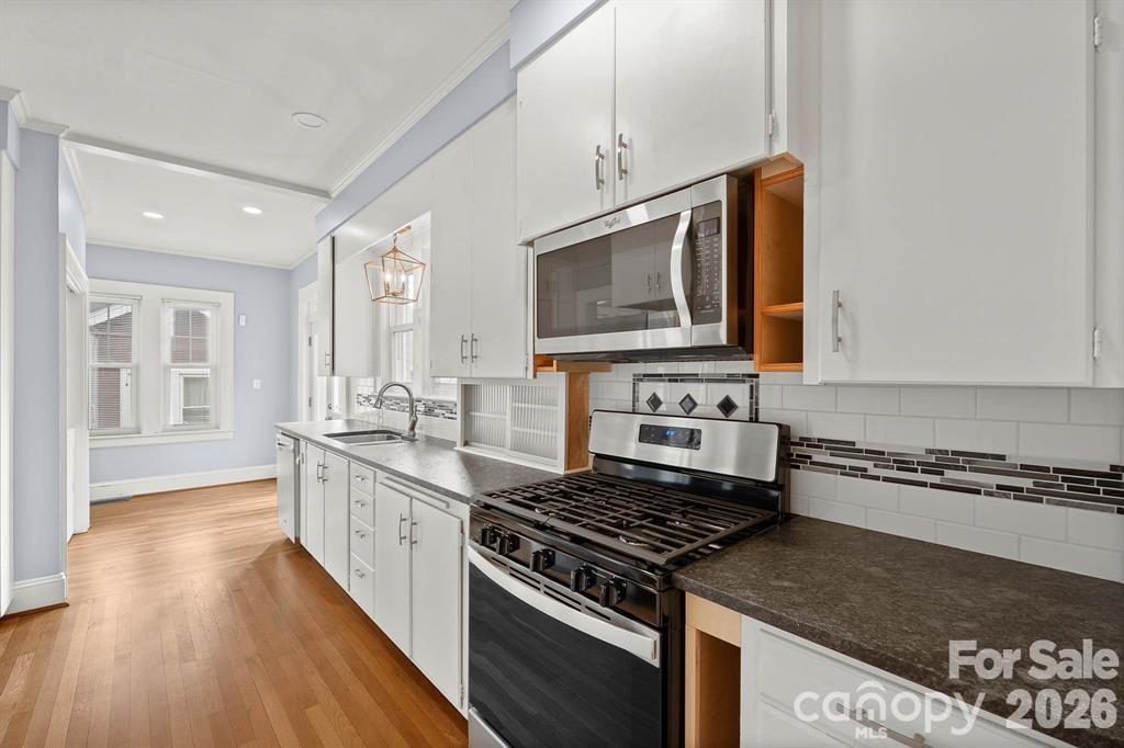 333 7th Street Northwest Hickory, NC 28601 - Photo 10 of 23 a kitchen with stainless steel appliances granite countertop a stove and a microwave