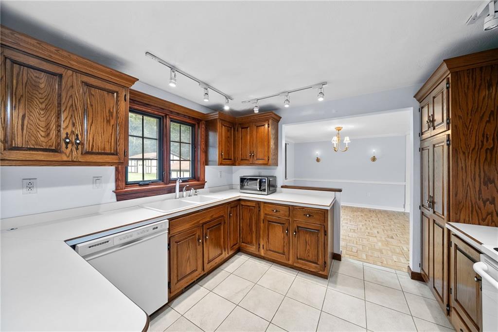 94 Ohare Road Canonsburg, PA 15317 - Photo 14 of 50 Generous counter space wraps around the kitchen, while windows above the sink bring in natural light and views of the backyard.