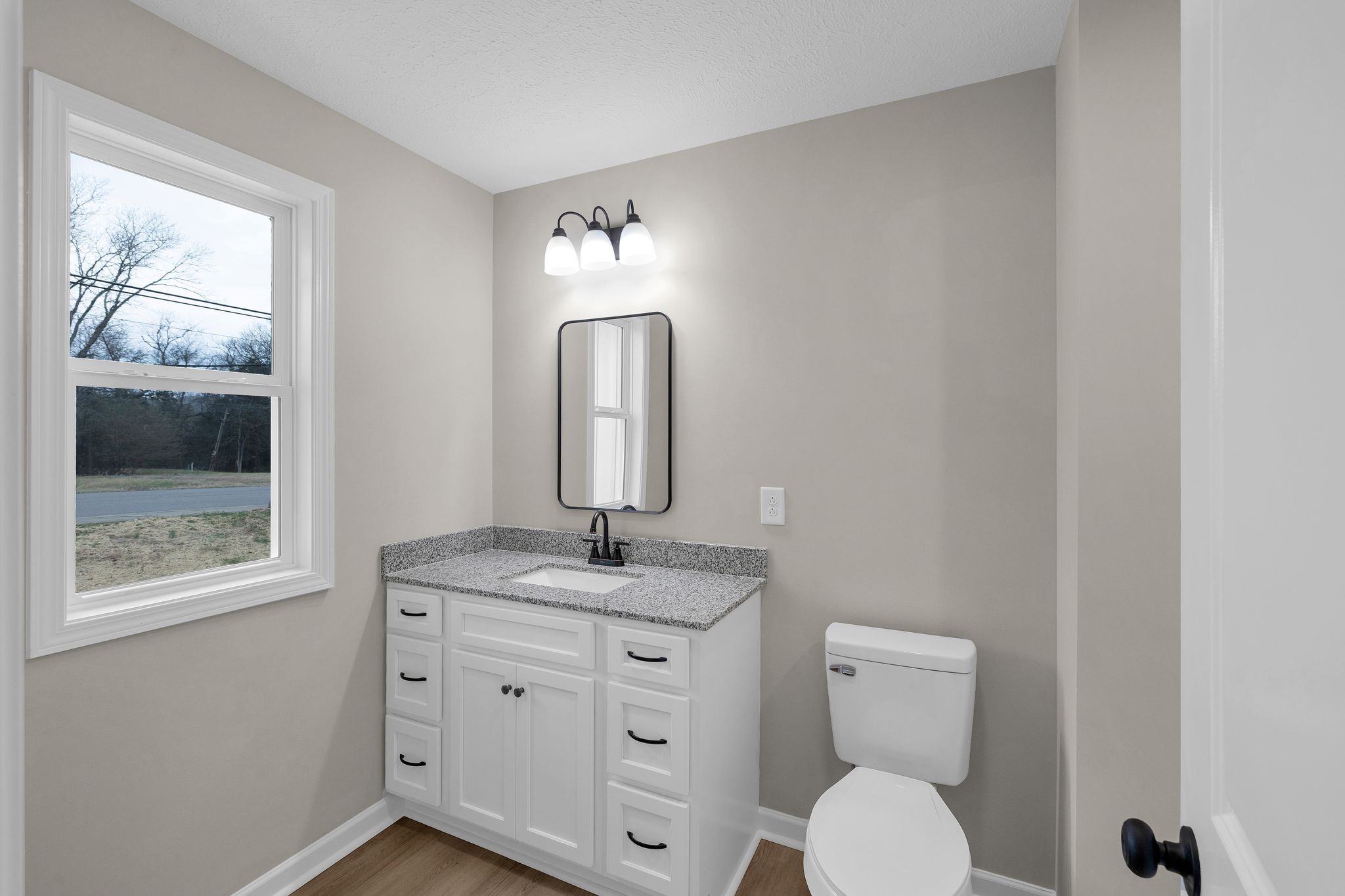 1536 Old Columbia Road Lewisburg, TN 37091 - Photo 15 of 22 a bathroom with a toilet a sink and mirror