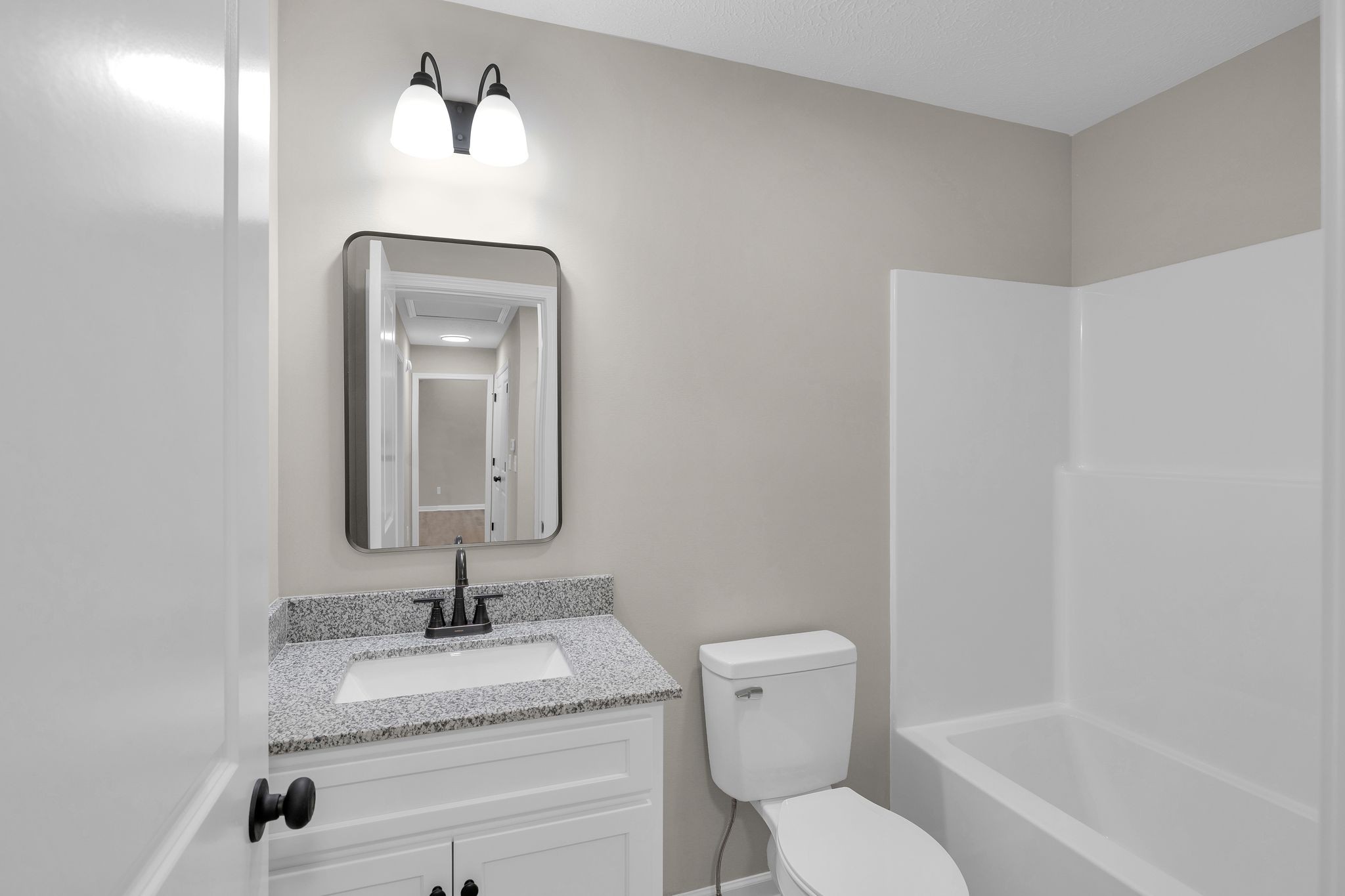 1536 Old Columbia Road Lewisburg, TN 37091 - Photo 18 of 22 a bathroom with a granite countertop toilet sink and mirror