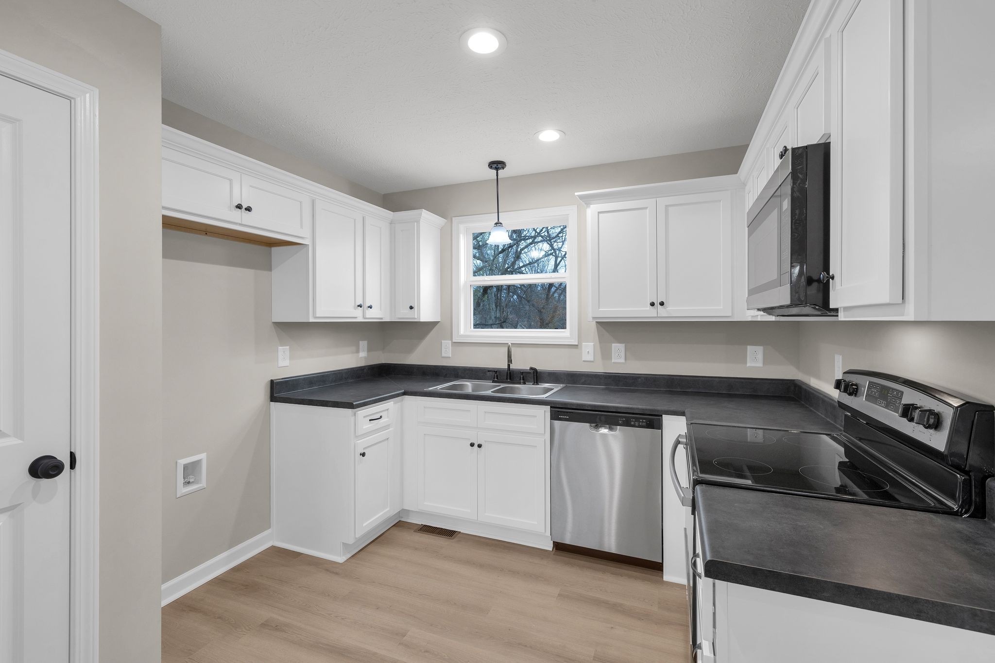 1536 Old Columbia Road Lewisburg, TN 37091 - Photo 8 of 22 a kitchen with stainless steel appliances granite countertop a sink stove and cabinets
