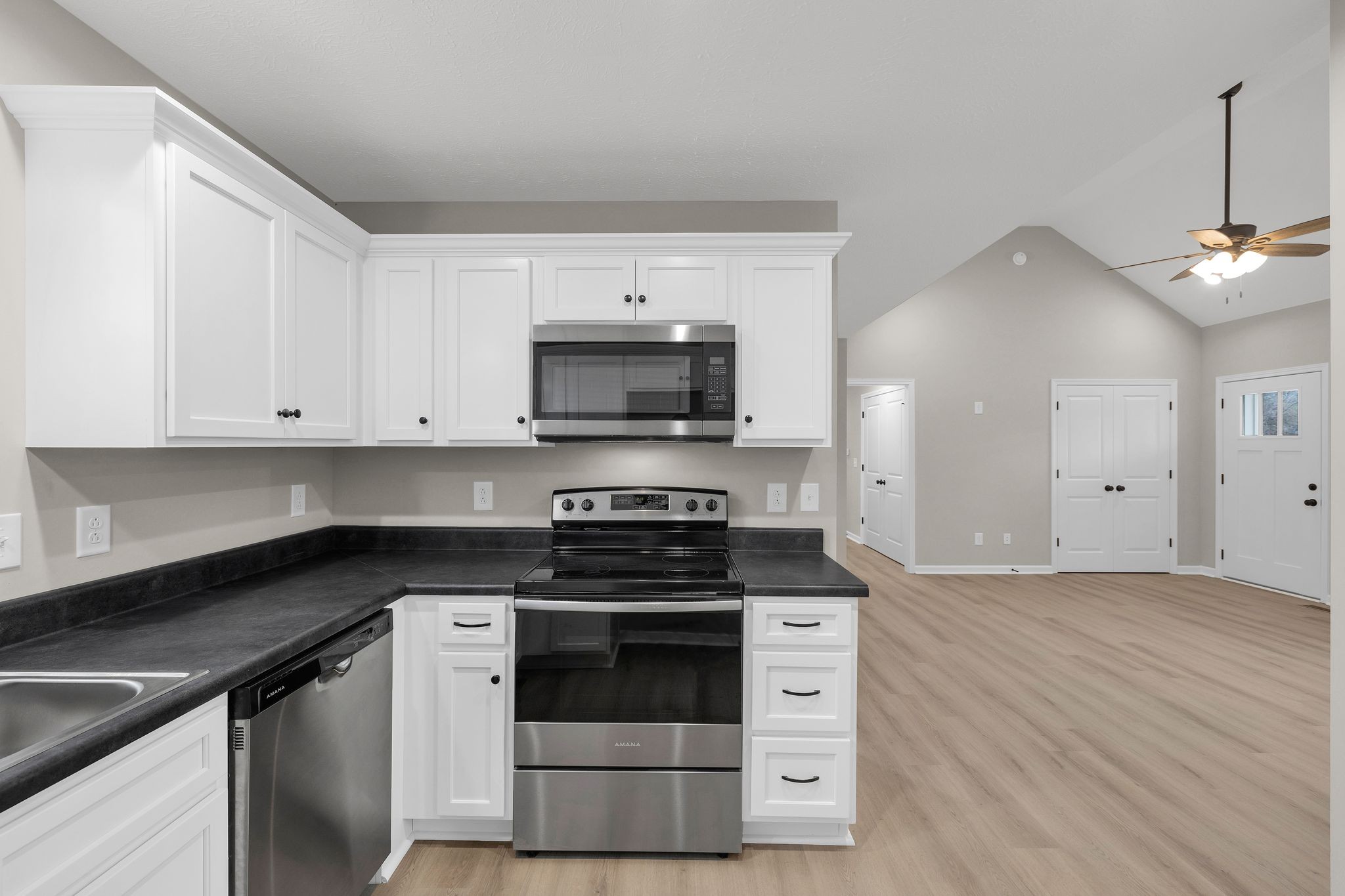 1536 Old Columbia Road Lewisburg, TN 37091 - Photo 9 of 22 a kitchen with stainless steel appliances a stove a microwave and a hard wood floor