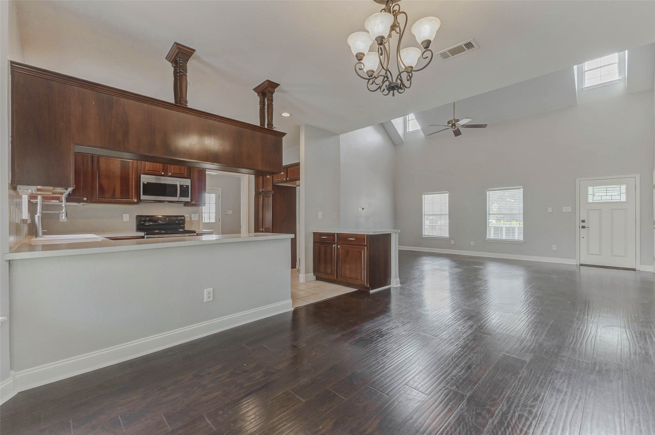 8411 Syms Street Fulshear, TX 77441 - Photo 13 of 29 a view of a kitchen with a sink and dishwasher