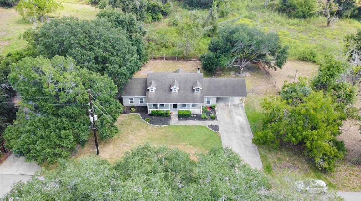 8411 Syms Street Fulshear, TX 77441 - Photo 2 of 29 an aerial view of a house with yard and green space