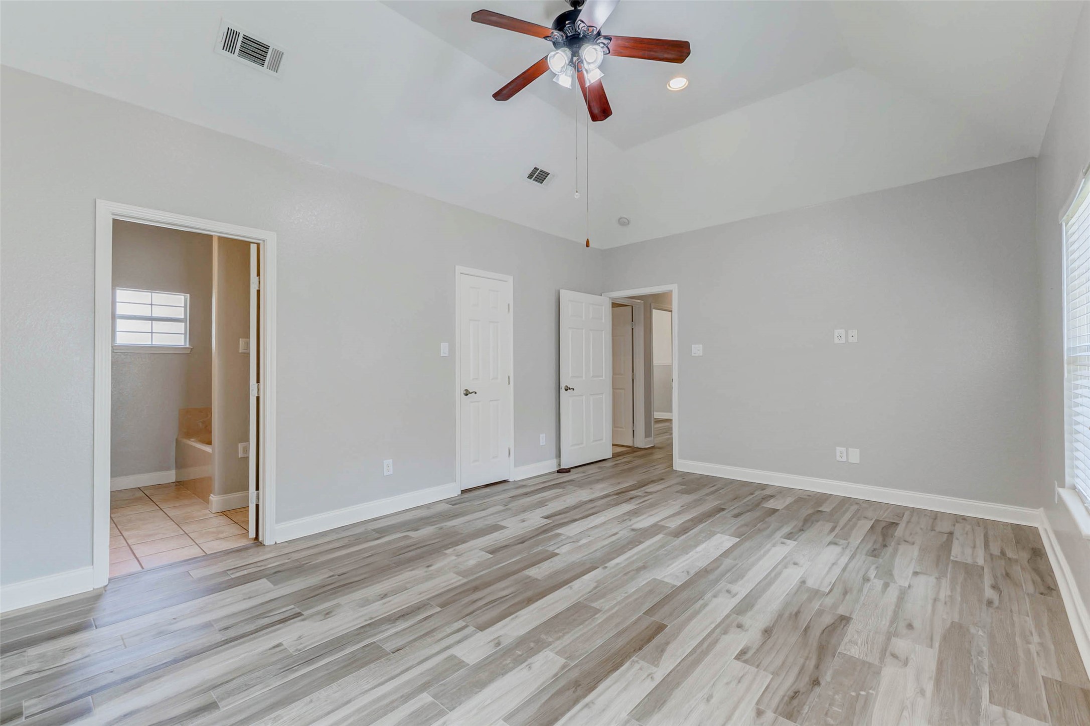 8411 Syms Street Fulshear, TX 77441 - Photo 24 of 29 a view of empty room with wooden floor