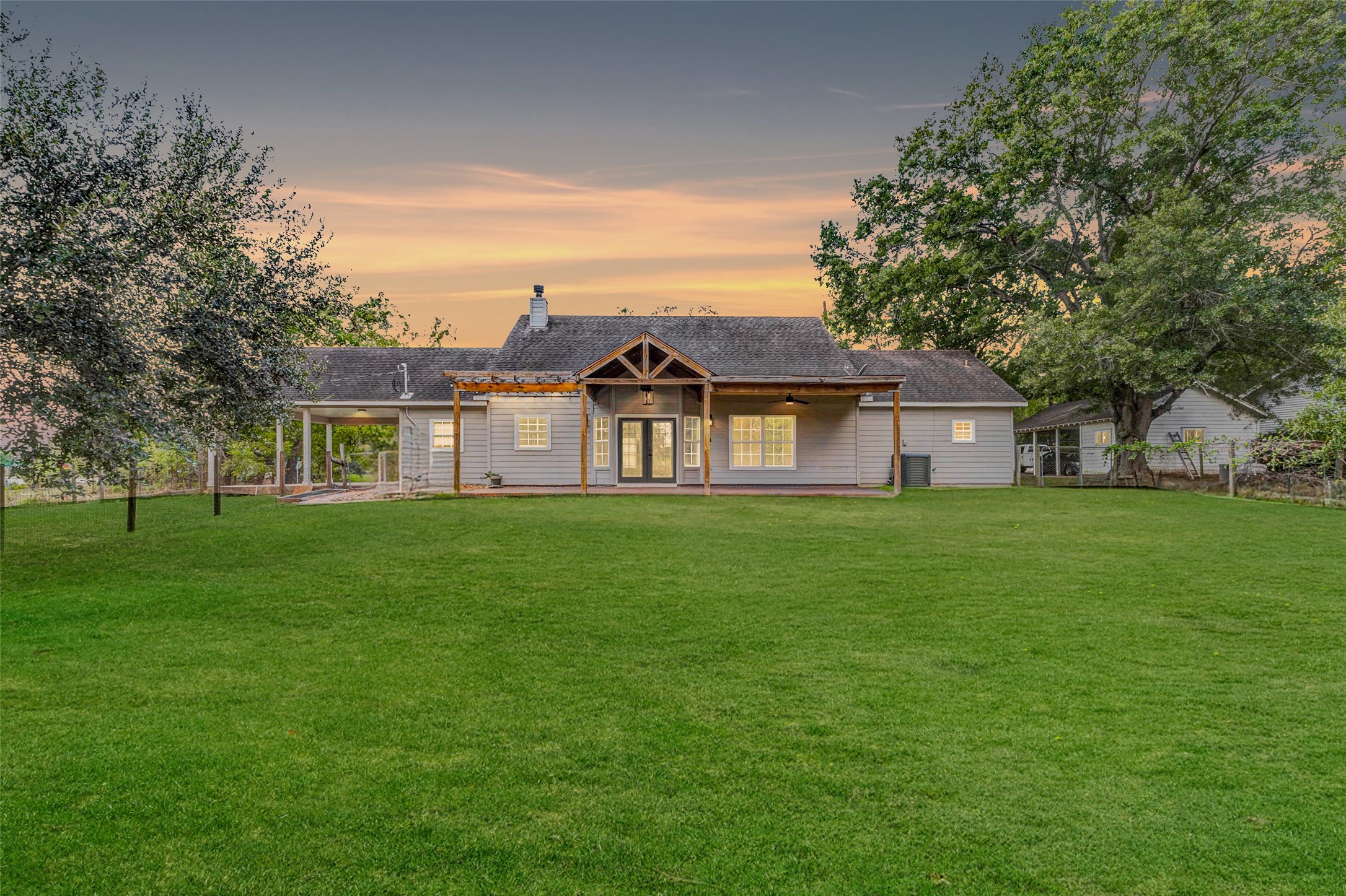 8411 Syms Street Fulshear, TX 77441 - Photo 26 of 29 a front view of a house with a yard