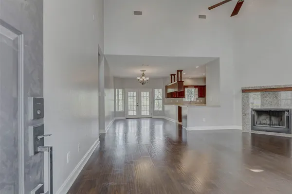 wooden floor in an empty room with a fireplace