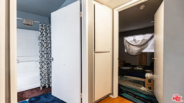 a close view of a utility room with washer and dryer