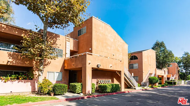 a front view of a building with street view