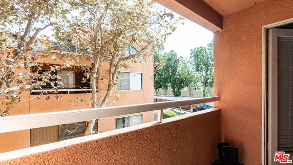 a view of street with large trees