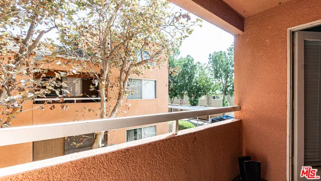 a view of street with large trees