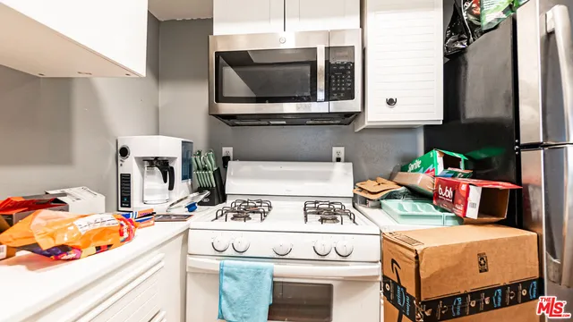 a kitchen with a stove and a microwave