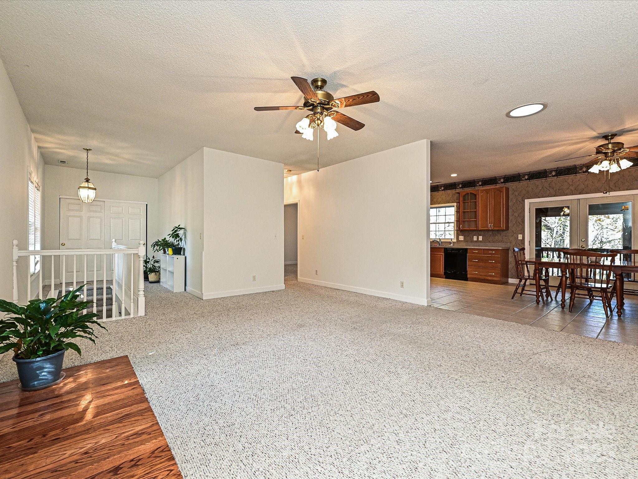 25040 Timberlake Drive Tega Cay, SC 29708 - Photo 9 of 40 a view of a livingroom with furniture and a potted plant