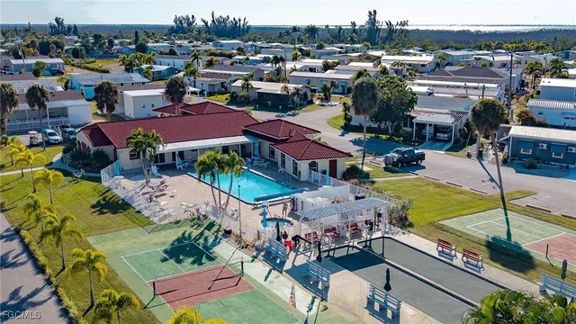 a view of swimming pool with outdoor seating and city view