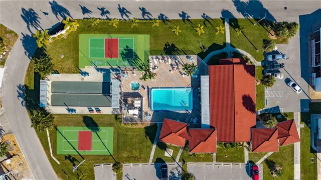 an aerial view of multiple houses with yard