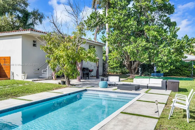 a view of swimming pool with patio