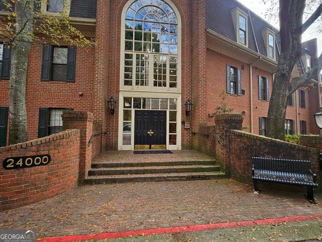 a view of a brick building with many windows
