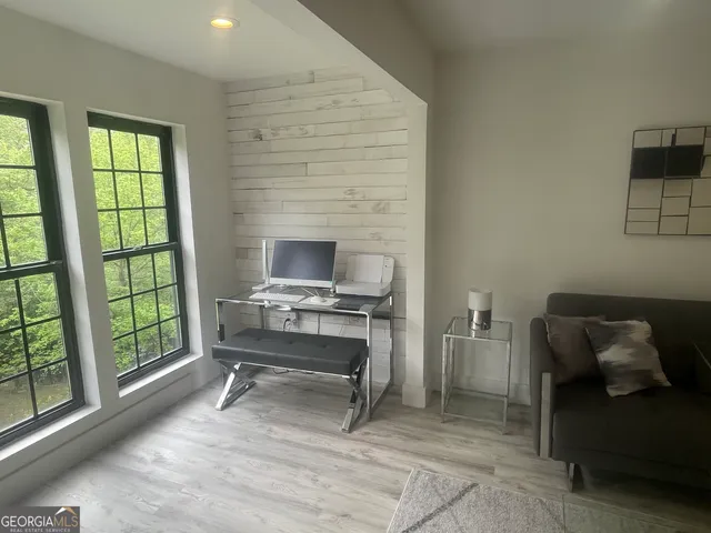 a workspace with furniture and a window