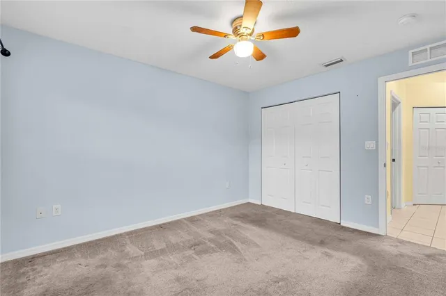 a view of room with window and wooden floor