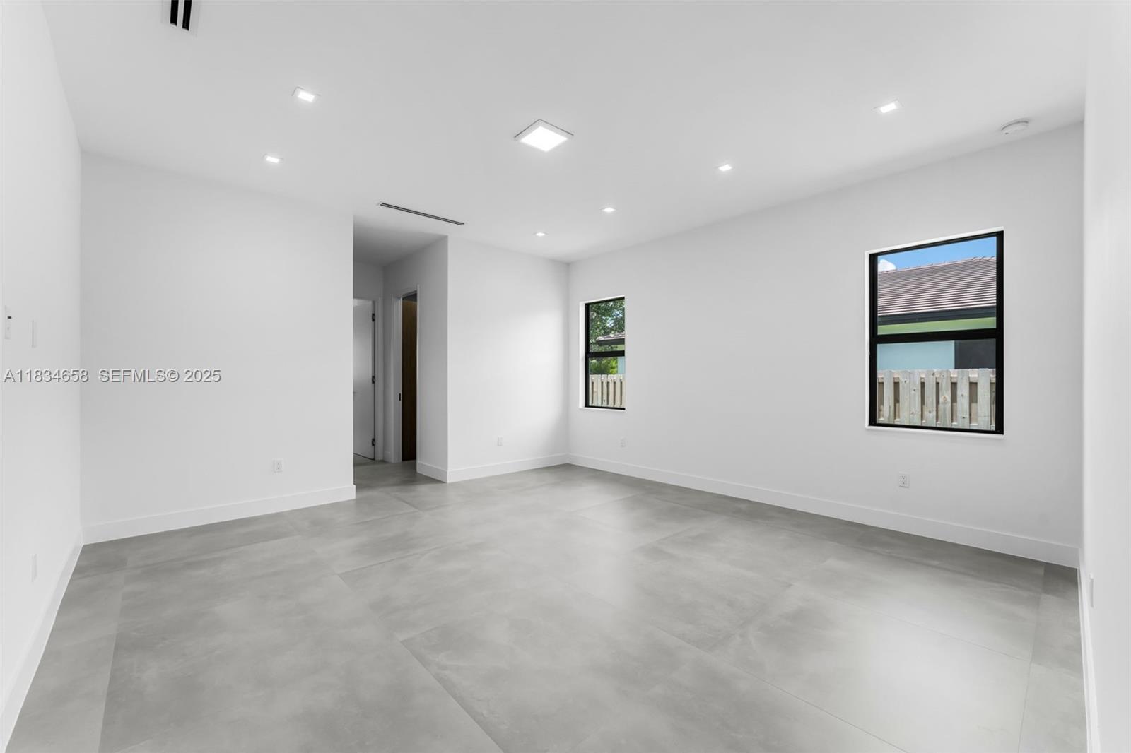 8220 Southwest 193rd Terrace Cutler Bay, FL 33157 - Photo 20 of 59 an empty room with windows and closet