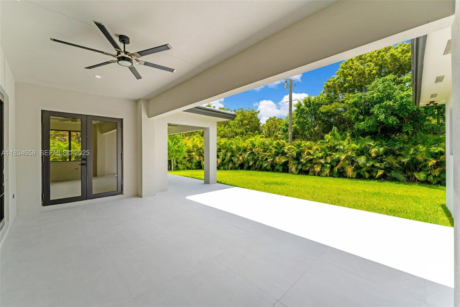 8220 Southwest 193rd Terrace Cutler Bay, FL 33157 - Photo 4 of 59 a view of a porch with a backyard
