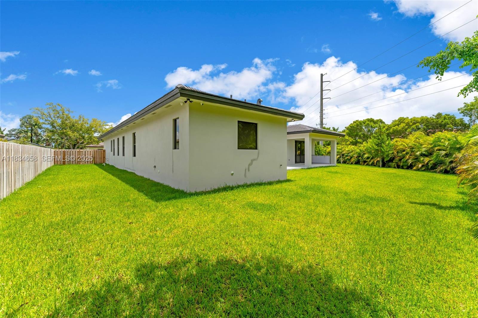 8220 Southwest 193rd Terrace Cutler Bay, FL 33157 - Photo 43 of 59 a house view with a garden space