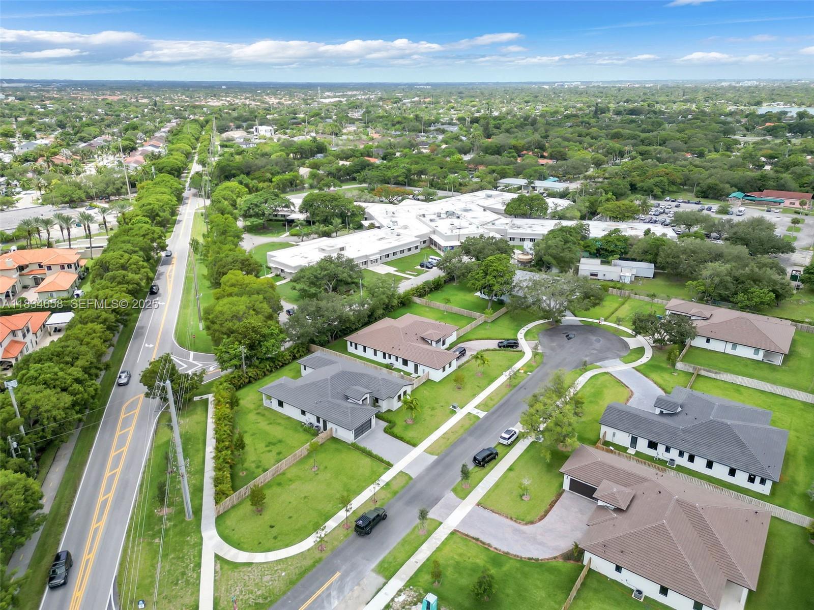 8220 Southwest 193rd Terrace Cutler Bay, FL 33157 - Photo 51 of 59 an aerial view of residential houses with outdoor space and street view