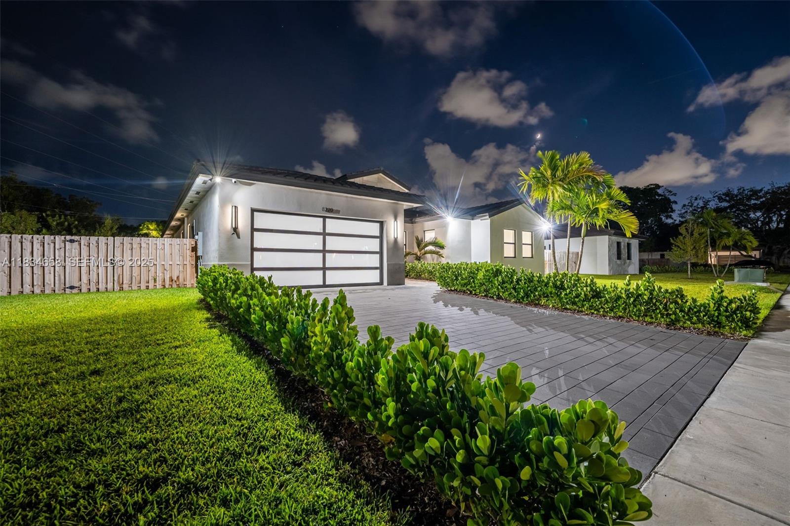 8220 Southwest 193rd Terrace Cutler Bay, FL 33157 - Photo 56 of 59 a view of a house with a big yard and large tree