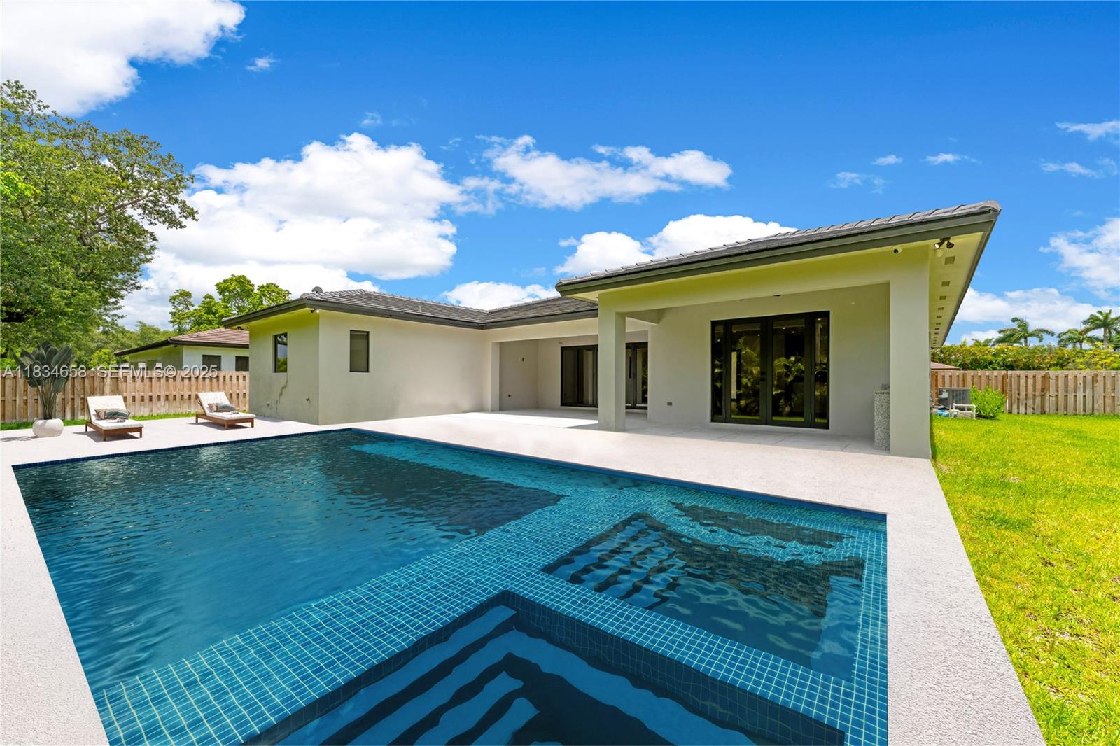 8220 Southwest 193rd Terrace Cutler Bay, FL 33157 - Photo 59 of 59 a view of a house with a yard