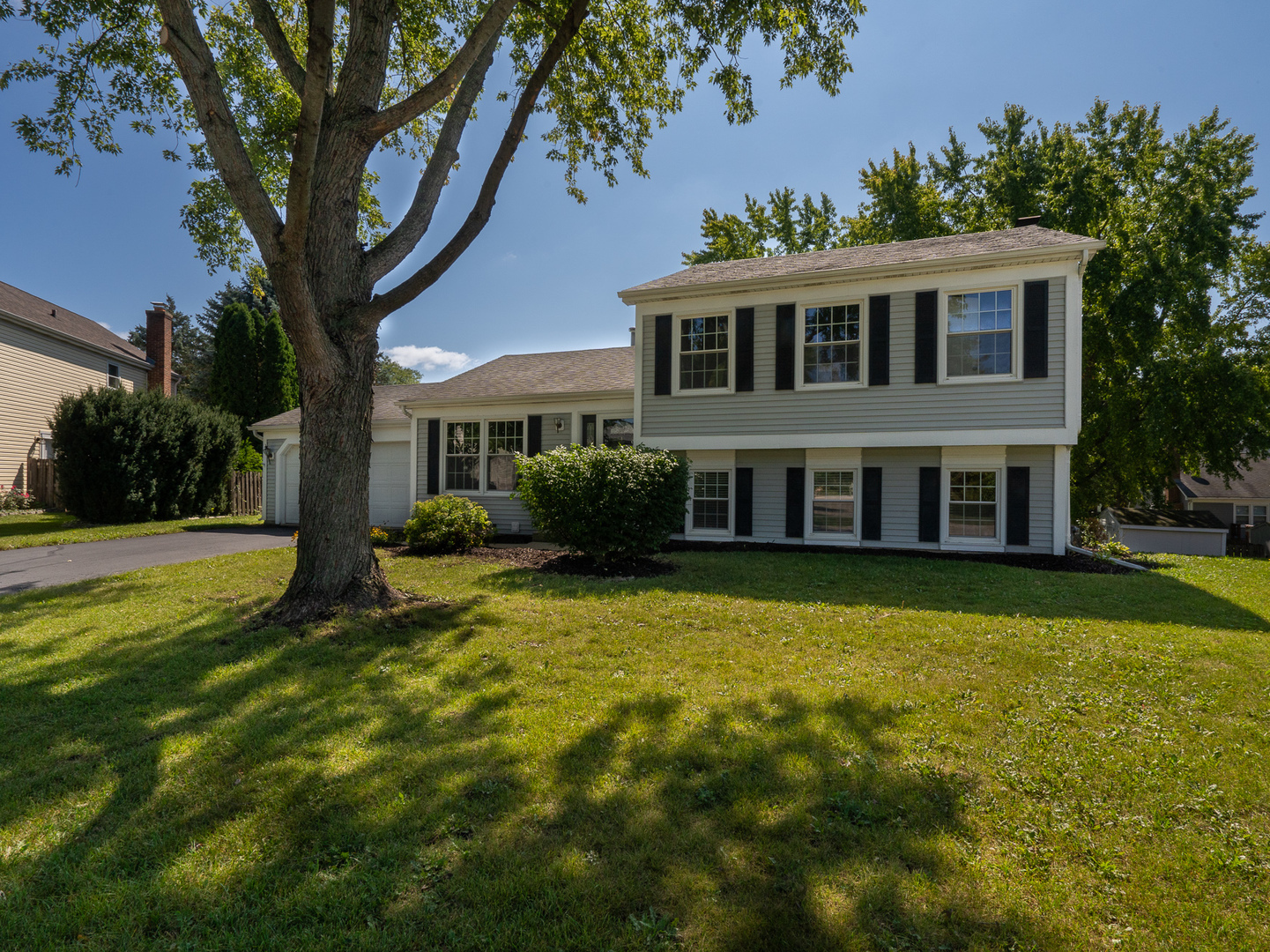 446 Hunters Way Fox River Grove, IL 60021 - Photo 1 of 23 a front view of house with yard and green space