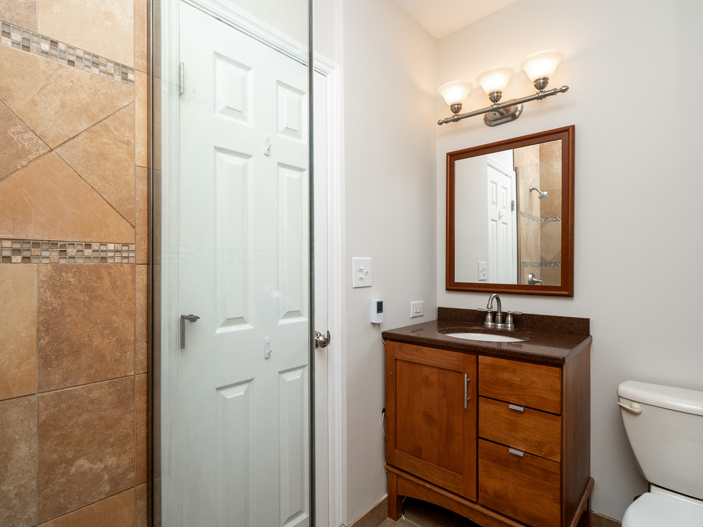 446 Hunters Way Fox River Grove, IL 60021 - Photo 13 of 23 a bathroom with a toilet sink and mirror