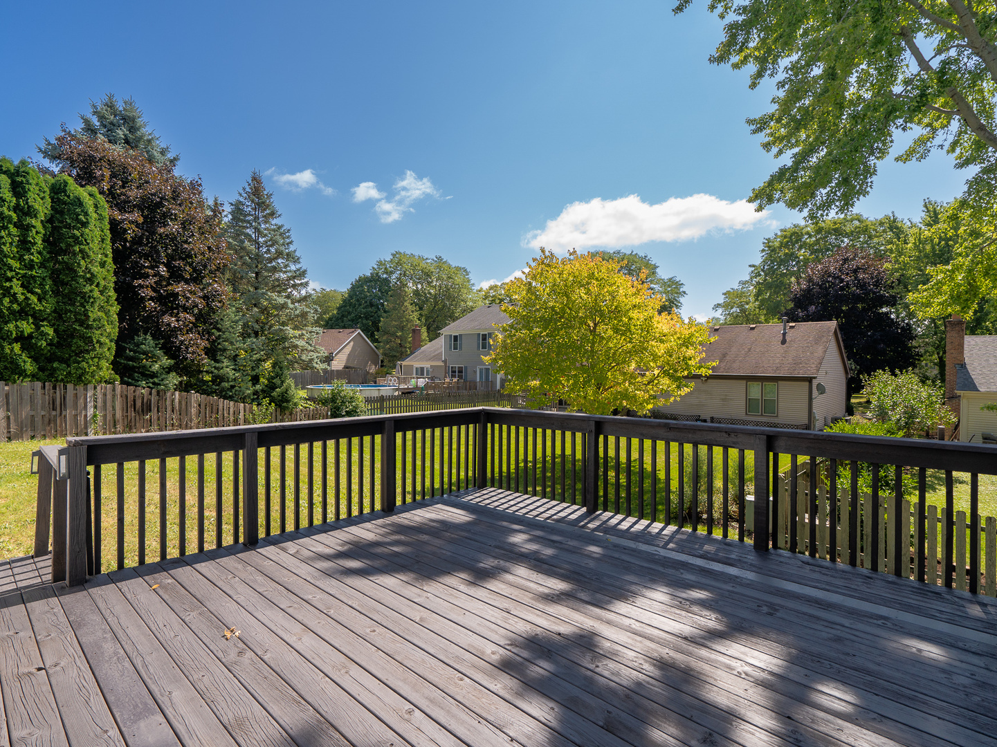 446 Hunters Way Fox River Grove, IL 60021 - Photo 22 of 23 a balcony with wooden floor and fence