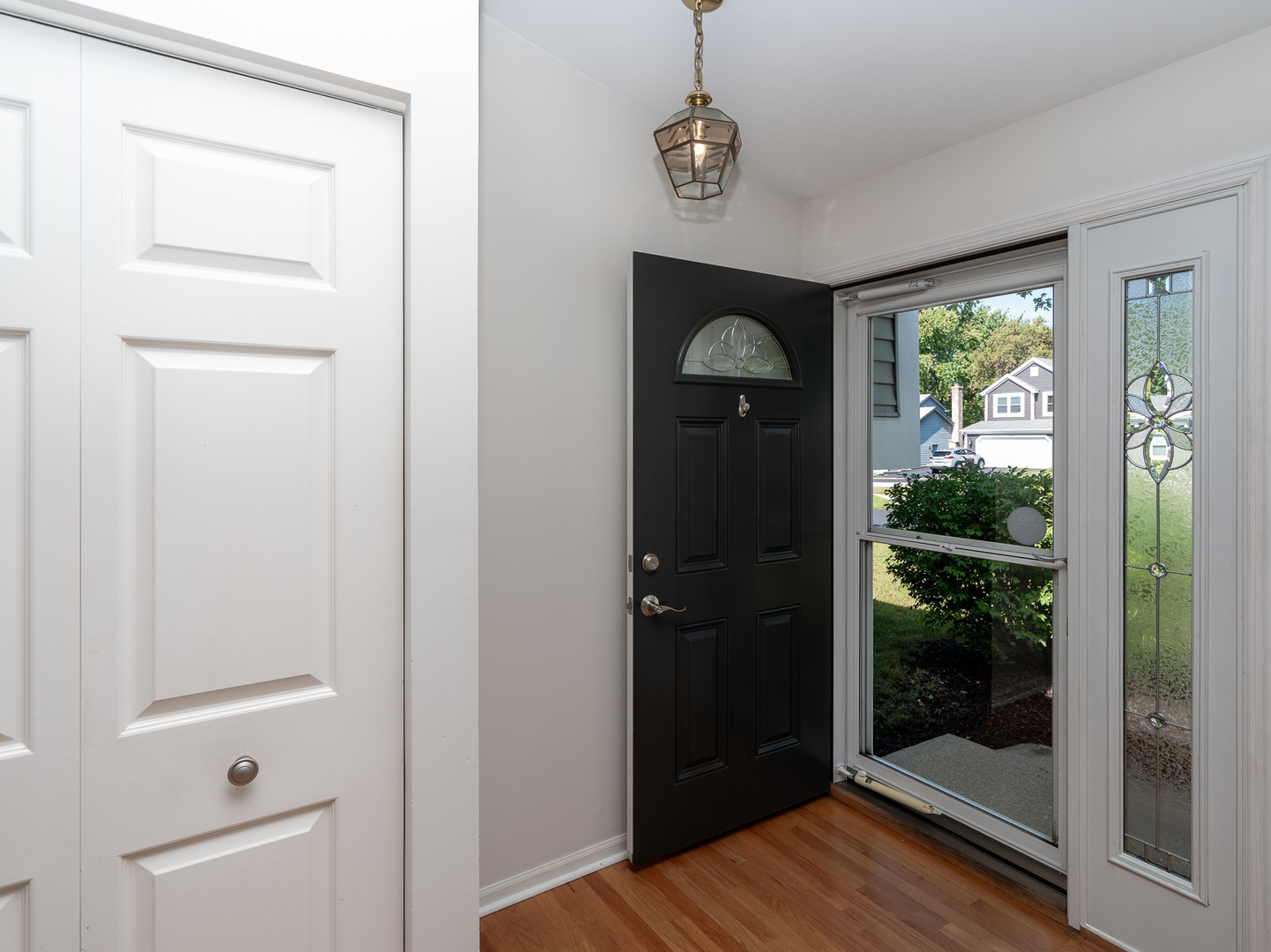 446 Hunters Way Fox River Grove, IL 60021 - Photo 3 of 23 a view of hallway with window and chandelier