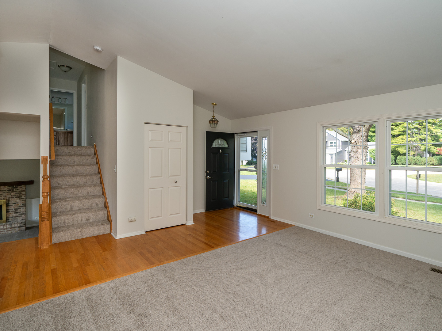446 Hunters Way Fox River Grove, IL 60021 - Photo 4 of 23 wooden floor in an empty room with a window