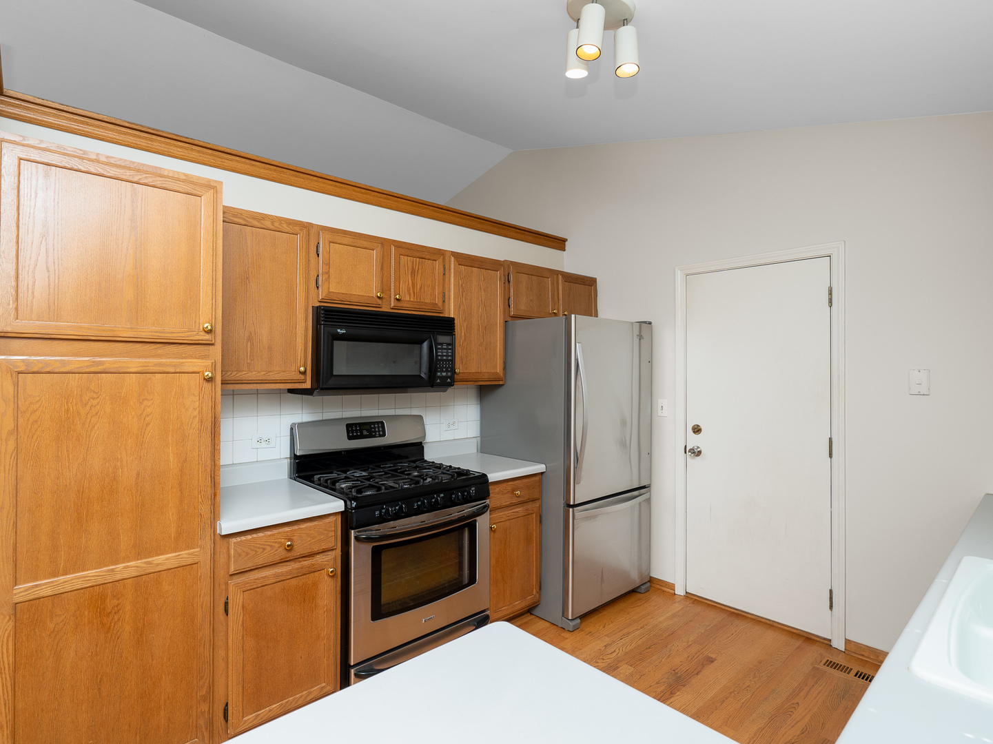 446 Hunters Way Fox River Grove, IL 60021 - Photo 5 of 23 a kitchen with stainless steel appliances a refrigerator stove and microwave