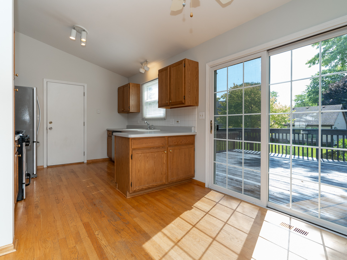 446 Hunters Way Fox River Grove, IL 60021 - Photo 7 of 23 a view of kitchen with furniture and large window