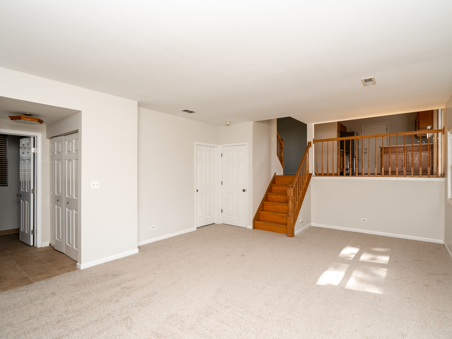 446 Hunters Way Fox River Grove, IL 60021 - Photo 9 of 23 a view of an empty room with stairs