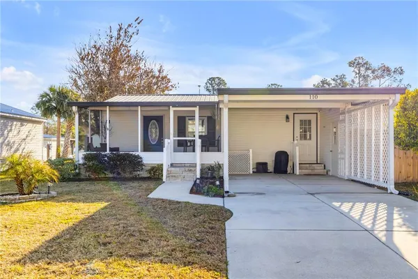 a view of a house with backyard