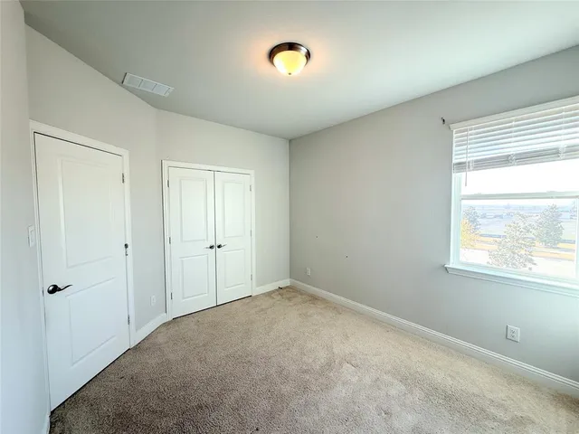 a view of a backyard of the house