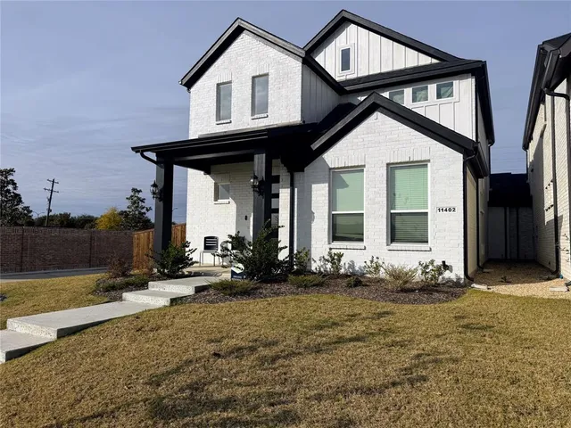 a view of a house with backyard and porch