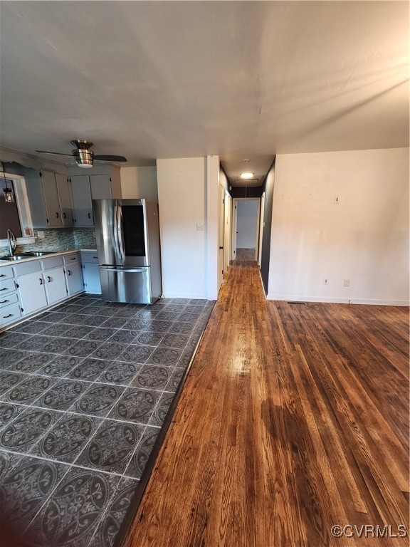 514 Conley Road Richmond, VA 23227 - Photo 6 of 15 Kitchen featuring white cabinets, backsplash, dark