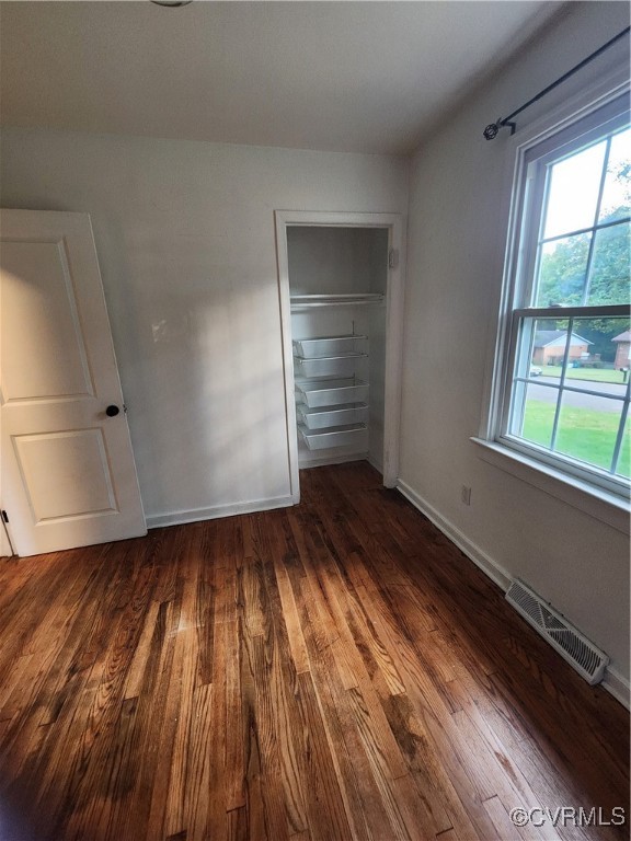 514 Conley Road Richmond, VA 23227 - Photo 9 of 15 Unfurnished bedroom with a closet and dark hardwoo