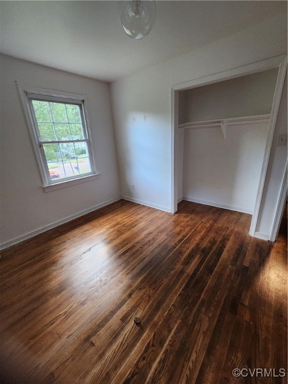 514 Conley Road Richmond, VA 23227 - Photo 10 of 15 Unfurnished bedroom featuring a closet and dark ha