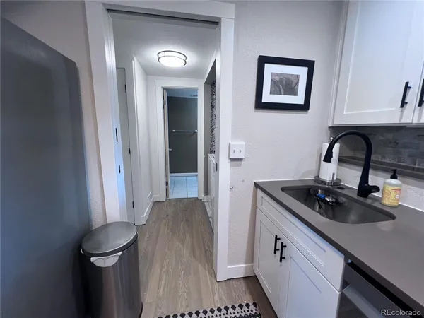 a kitchen with a sink and a stove