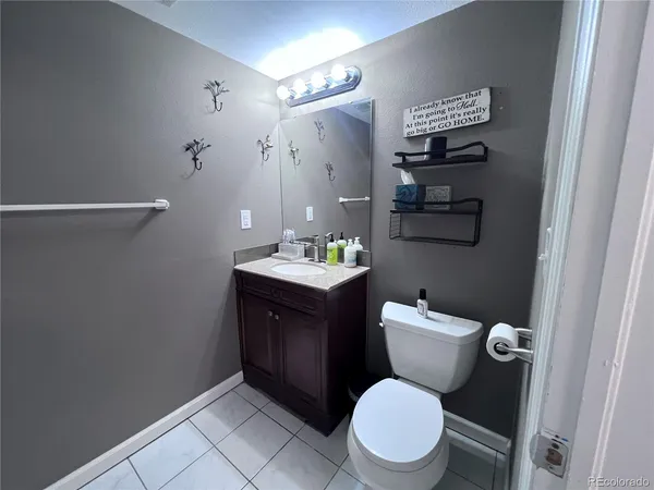 a bathroom with a toilet and a sink