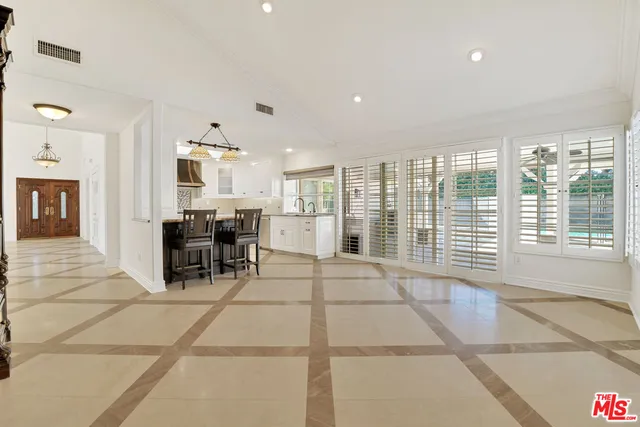 a view of a kitchen with furniture and windows