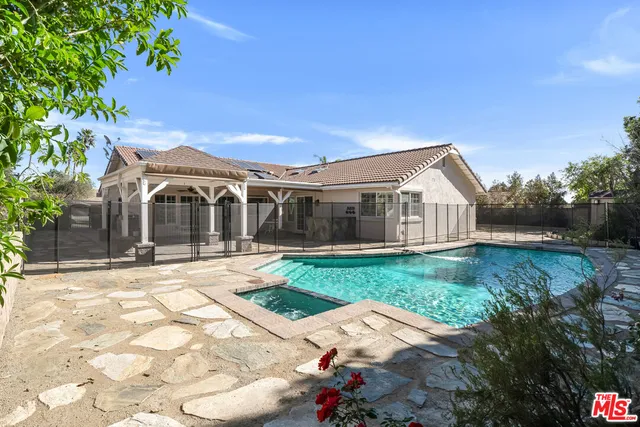 a view of a white house with a yard