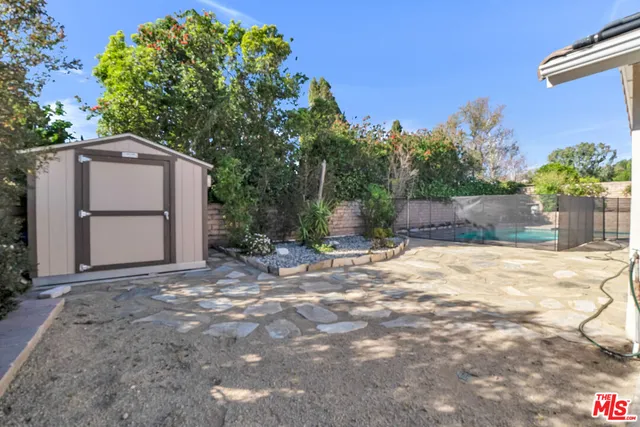 a view of a house with a yard and a garage