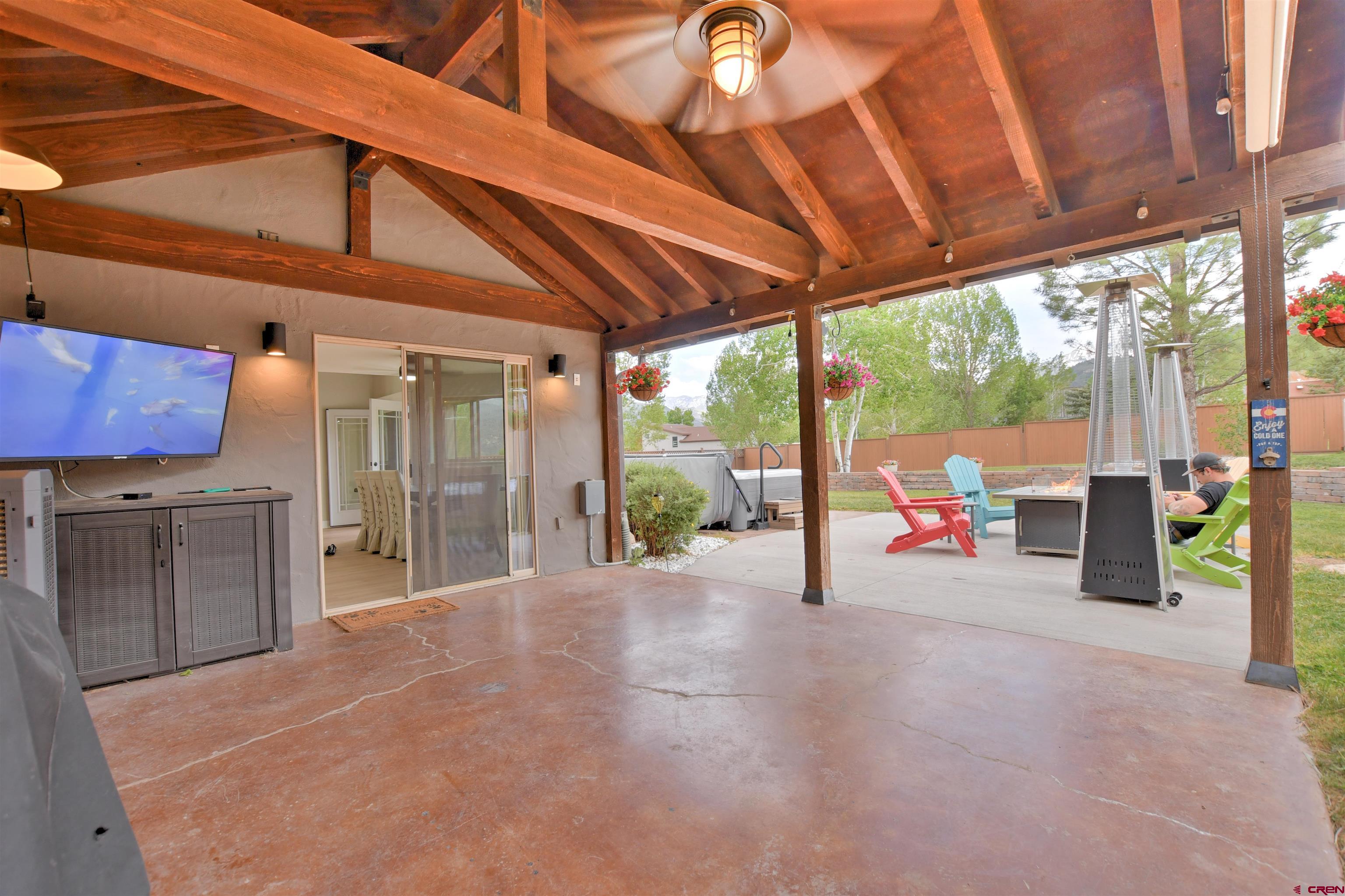 602 Chipeta Drive Ridgway, CO 81432 - Photo 31 of 41 a view of a porch with furniture and floor to ceiling window